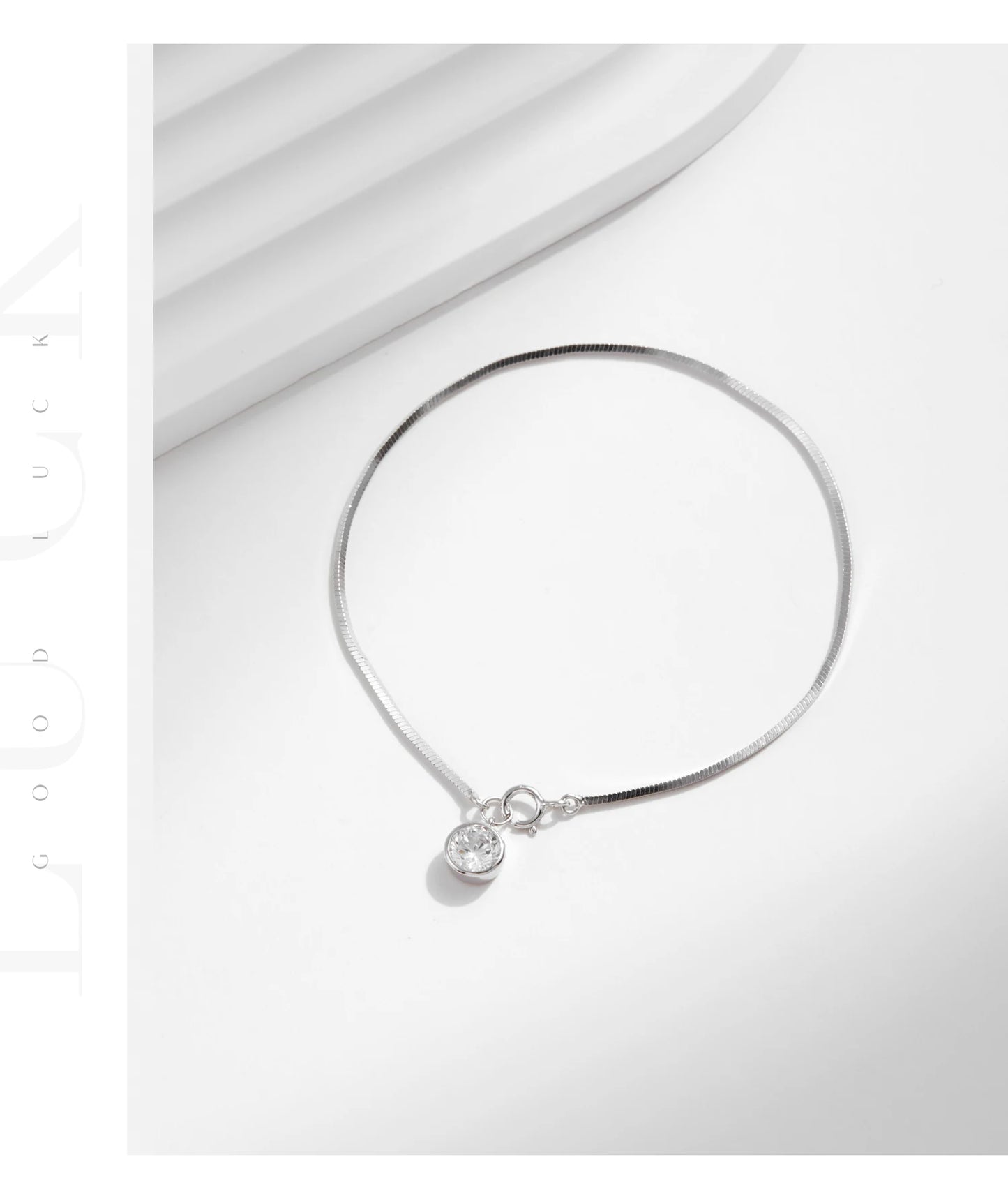 The IceBoyDC 925 Dainty Snake Bracelet w/ Dangling CZ