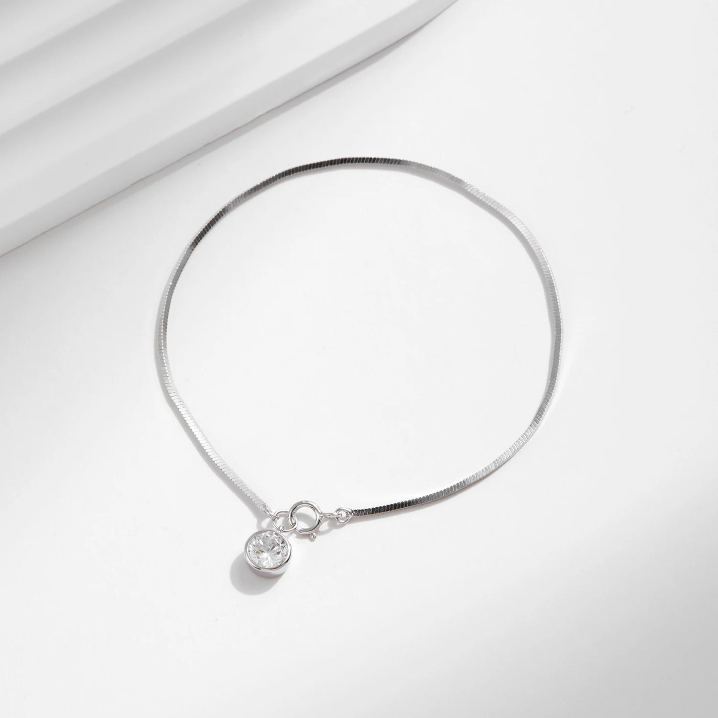The IceBoyDC 925 Dainty Snake Bracelet w/ Dangling CZ