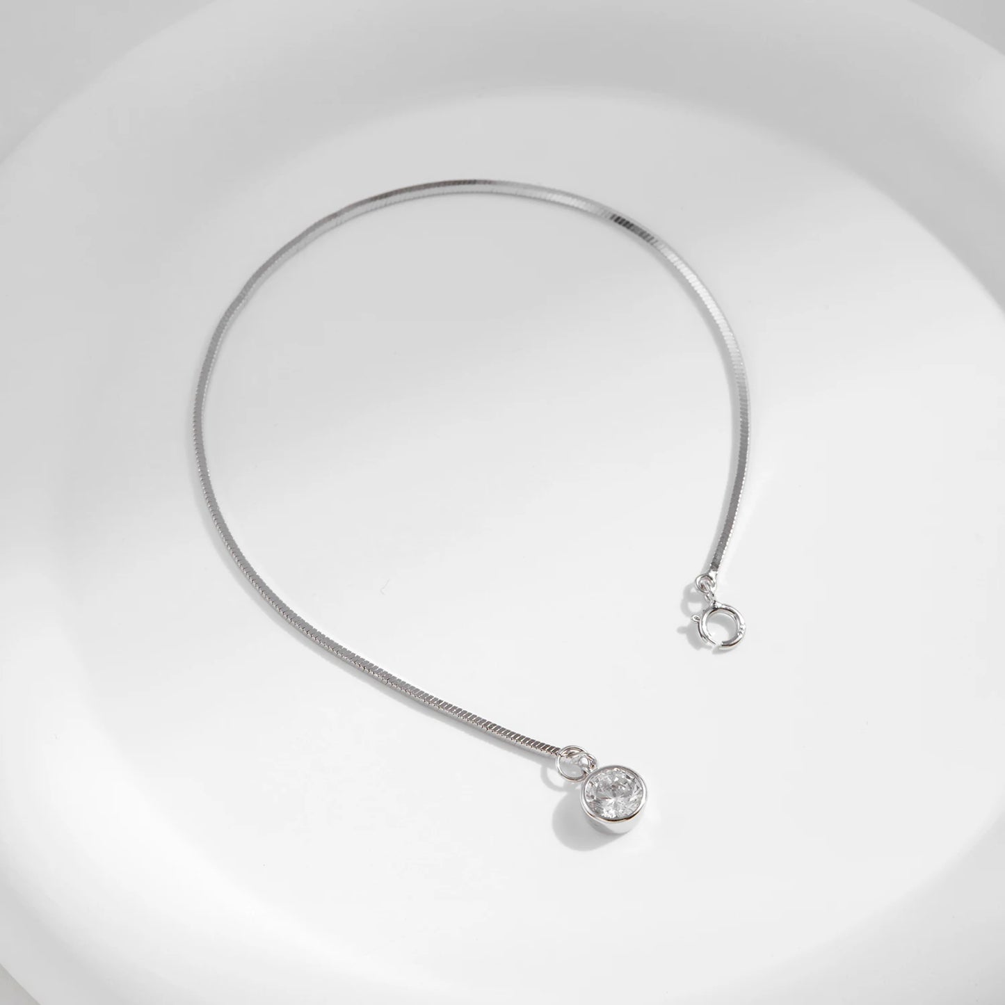The IceBoyDC 925 Dainty Snake Bracelet w/ Dangling CZ